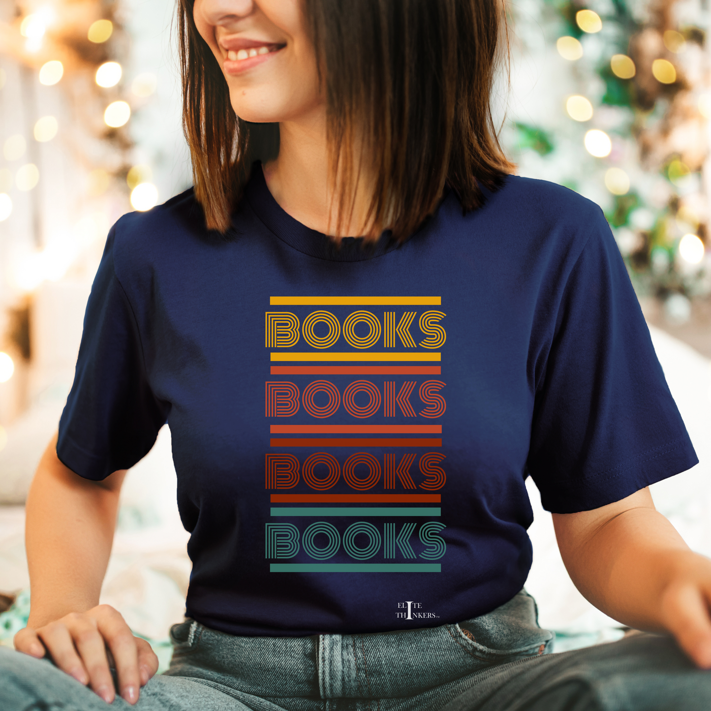 Multi-color 'books' stack on navy tee.